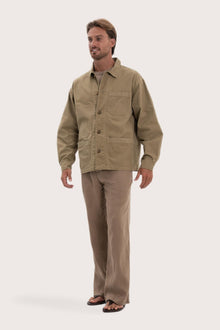 Side profile of the khaki cotton jacket showcasing its comfortable fit and clean lines