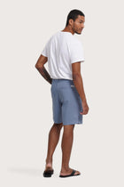 Back view of the light blue bermuda shorts with a relaxed and tailored silhouette