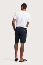 Back view of the navy bermuda shorts with a relaxed and tailored silhouette
