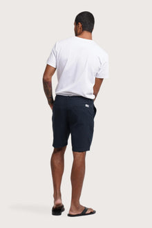 Back view of the navy bermuda shorts with a relaxed and tailored silhouette