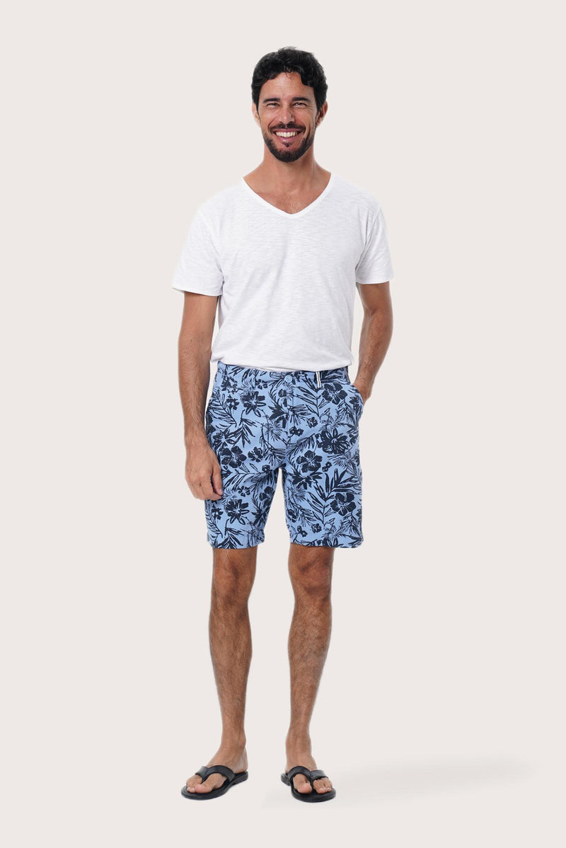 Front view of the Paulo Bermuda Shorts in Little Palm Light Blue print by By The Sea Bali