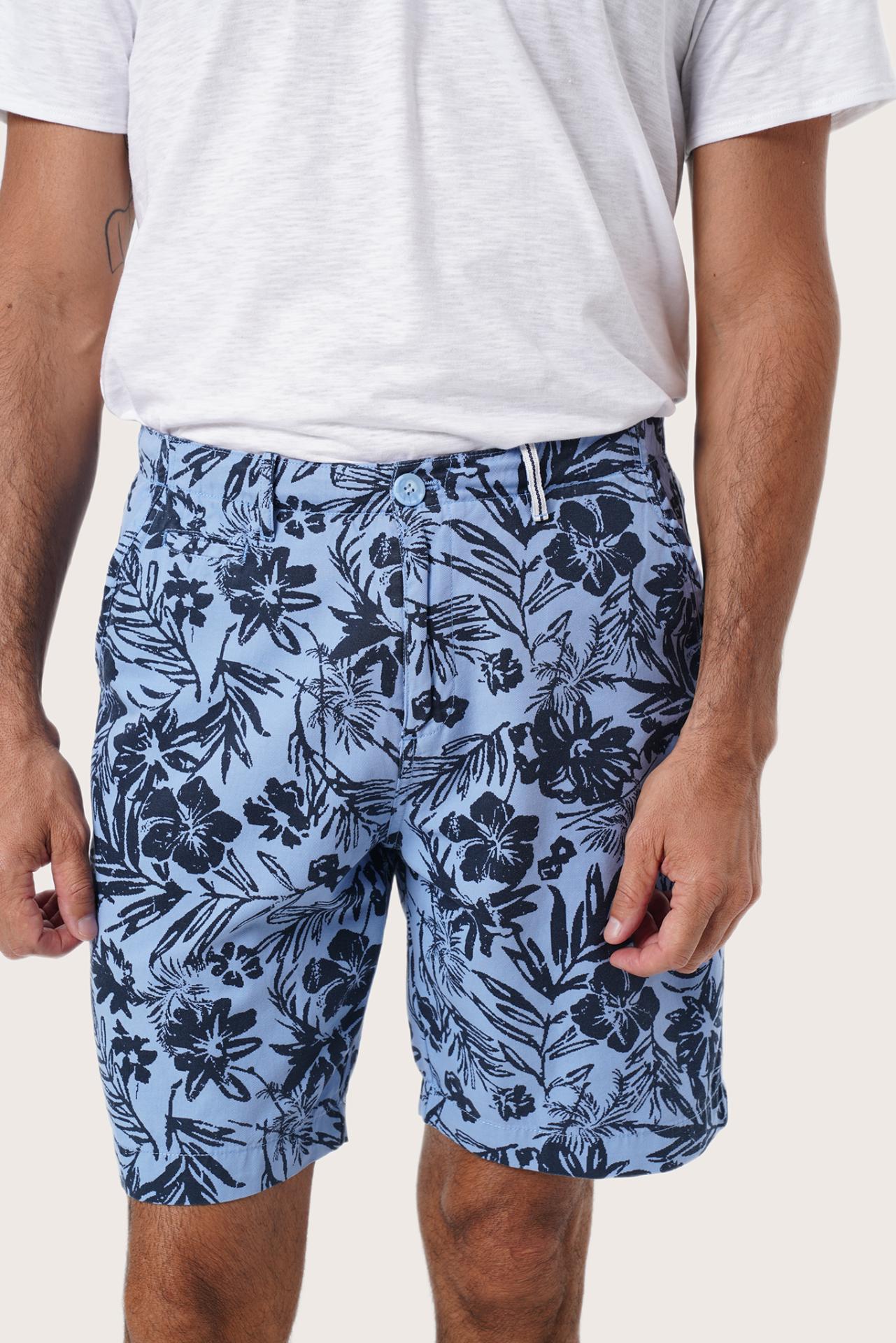 Men's resortwear styling featuring the Paulo Bermuda Shorts in Little Palm Light Blue by By The Sea Bali