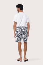 Front view of the Paulo Bermuda Shorts in Little Palm White print by By The Sea Bali