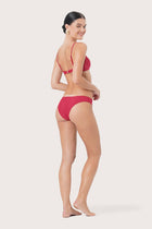 Side view of Pearl Bikini Top highlighting its sleek and feminine profile
