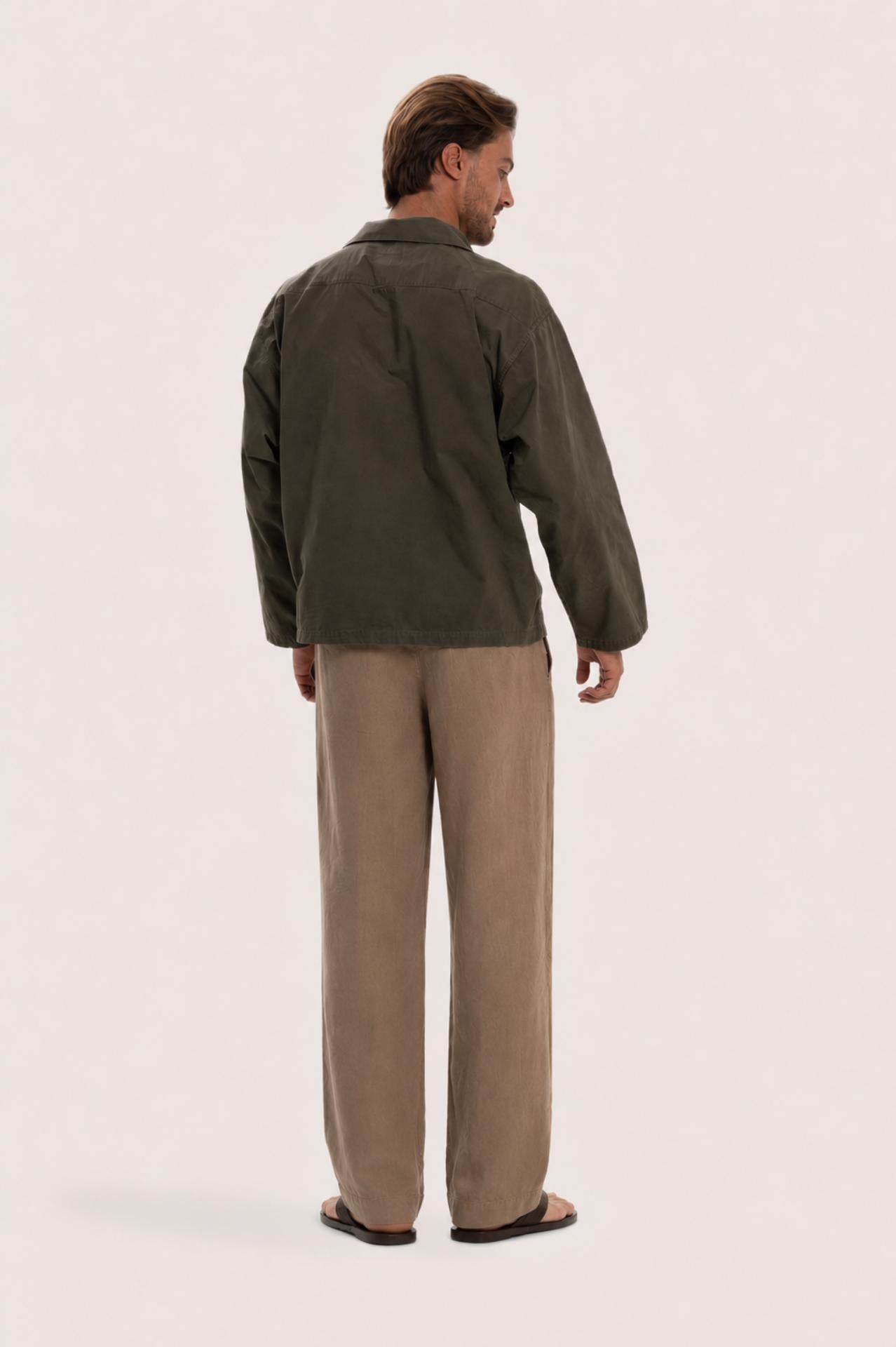 Back view of the dark brown cotton outerwear with a relaxed and contemporary silhouette