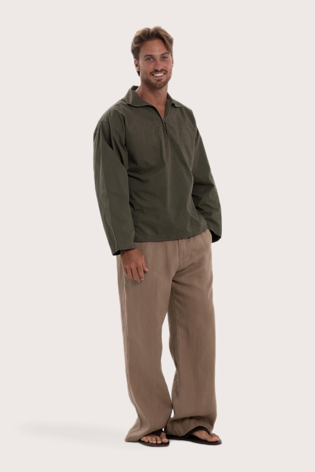 Side profile of the dark brown cotton outerwear showcasing its comfortable fit and effortless drape