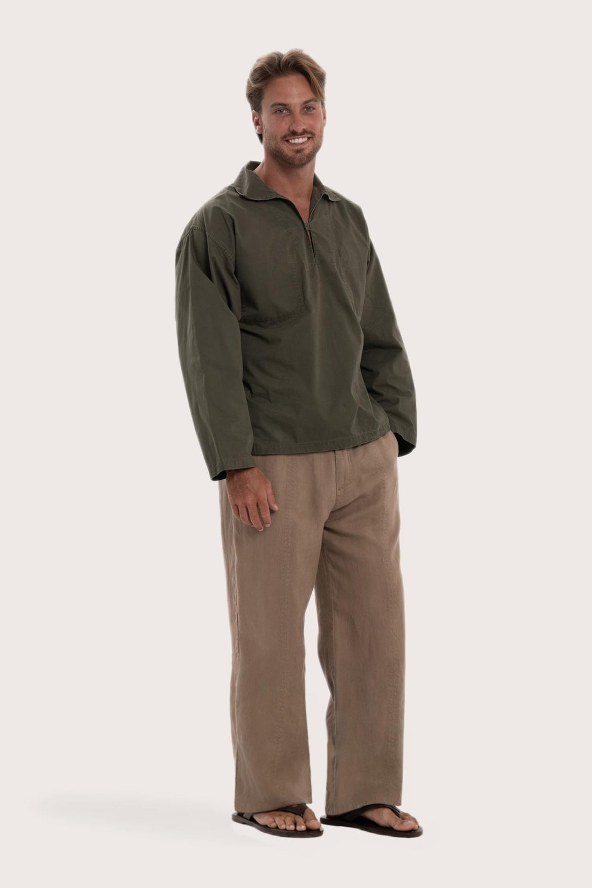 Side profile of the dark brown cotton outerwear showcasing its comfortable fit and effortless drape