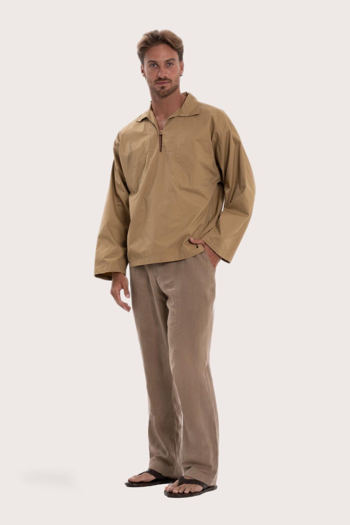 Side profile of the light brown cotton outerwear showcasing its comfortable fit and effortless drape