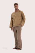 Side profile of the light brown cotton outerwear showcasing its comfortable fit and effortless drape
