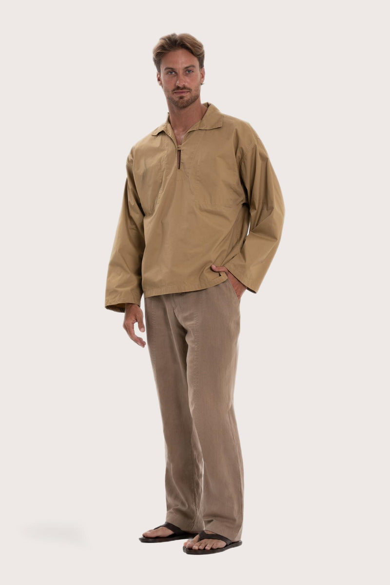 Side profile of the light brown cotton outerwear showcasing its comfortable fit and effortless drape