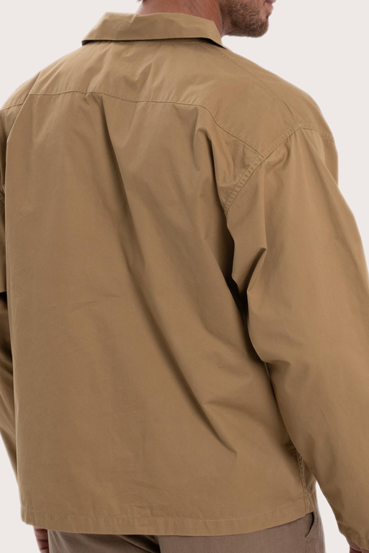 Detailed back view highlighting the relaxed silhouette and cotton craftsmanship