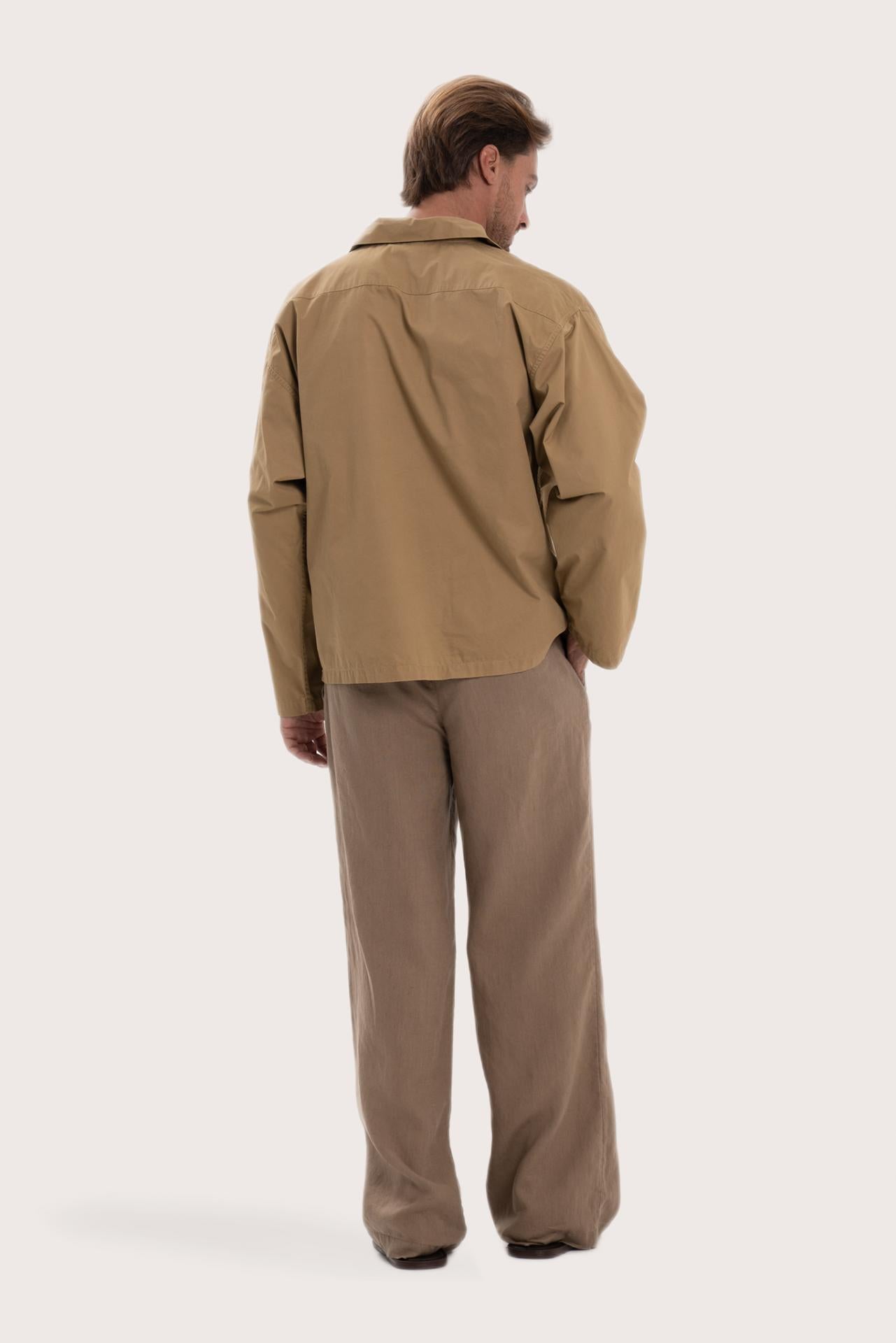 Back view of the light brown cotton outerwear with a relaxed and contemporary silhouette