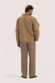 Back view of the light brown cotton outerwear with a relaxed and contemporary silhouette