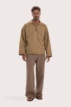 Model wearing the light brown cotton Pescador outerwear by By The Sea Bali