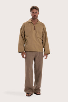 Model wearing the light brown cotton Pescador outerwear by By The Sea Bali