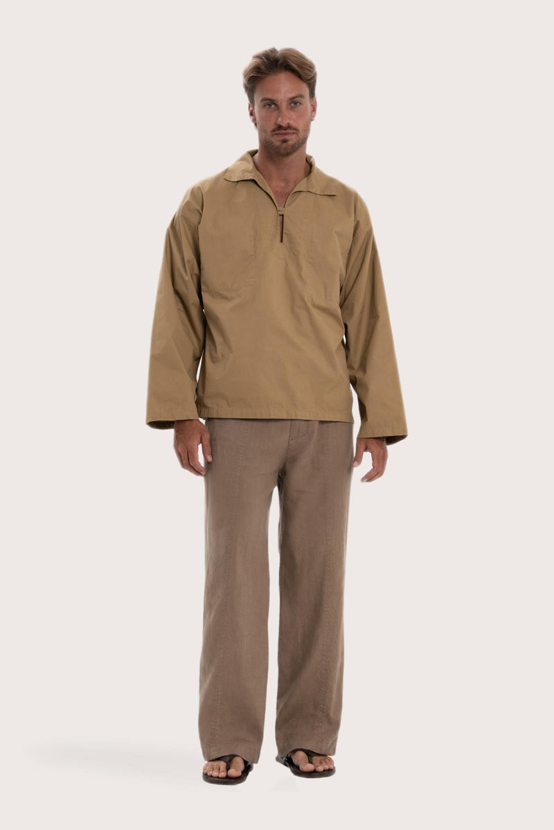Model wearing the light brown cotton Pescador outerwear by By The Sea Bali