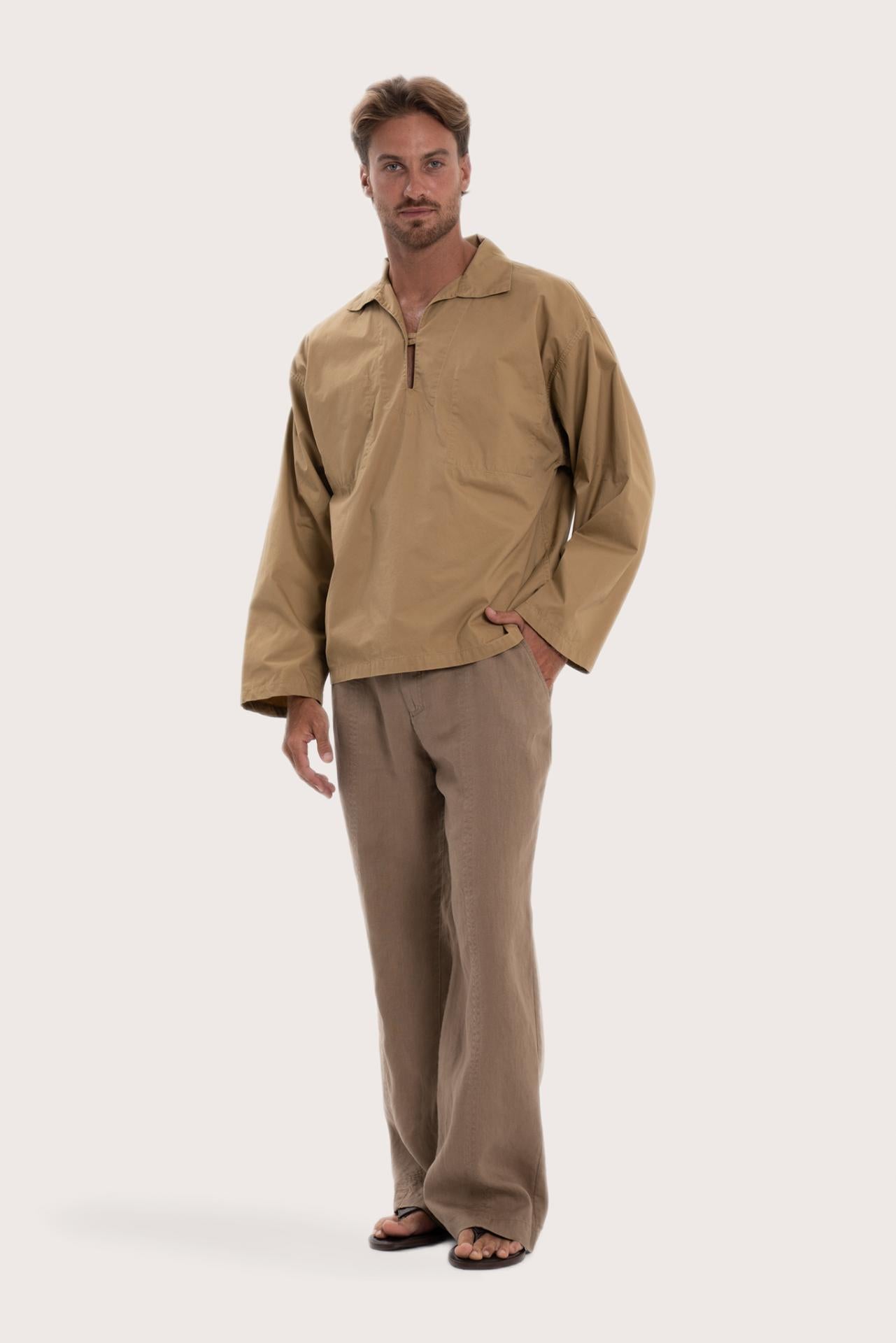 Side profile of the light brown cotton outerwear showcasing its comfortable fit and effortless drape