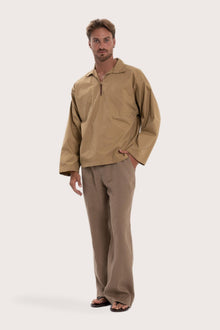 Side profile of the light brown cotton outerwear showcasing its comfortable fit and effortless drape