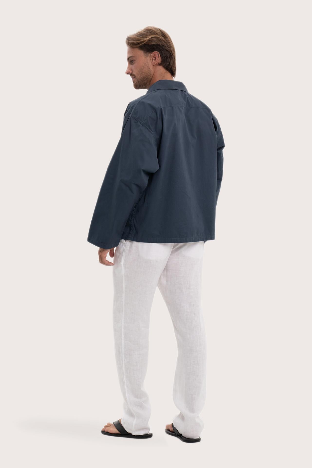 Back view of the navy cotton outerwear with a relaxed and contemporary silhouette
