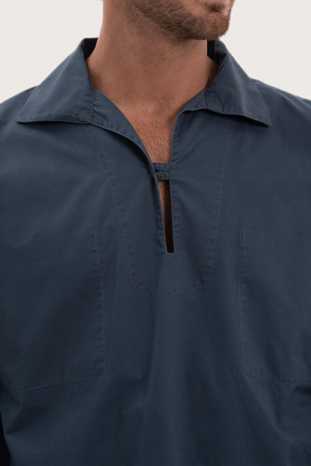 Close-up of the cotton fabric texture and refined detailing on the navy outerwear