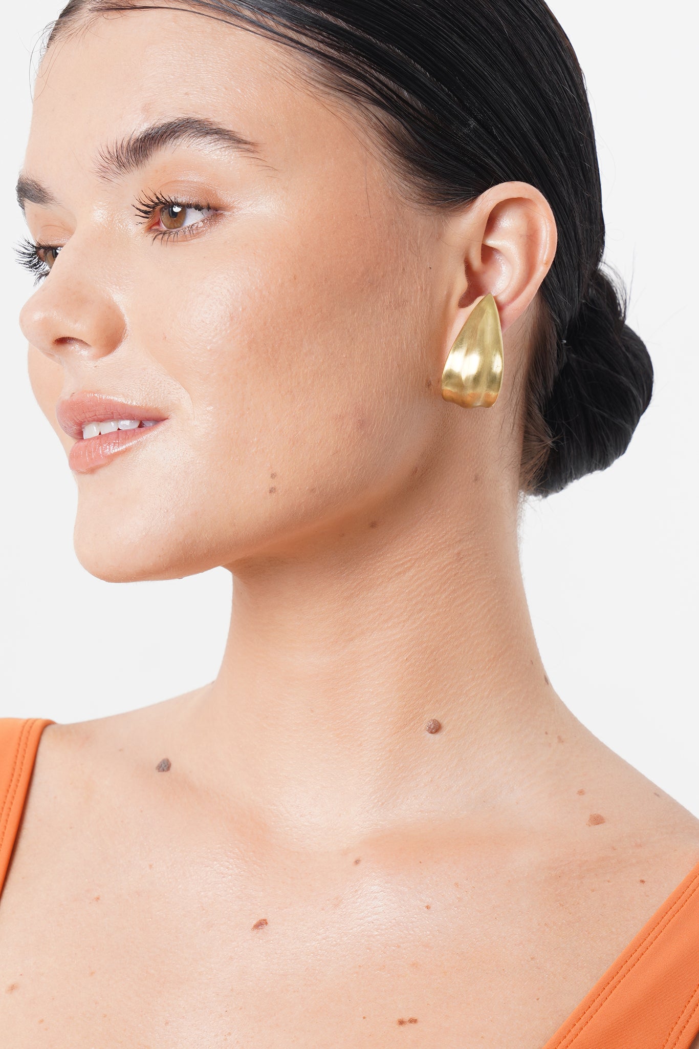 Side view of the Petal Earring highlighting its refined silhouette