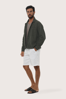 Side profile of the Deep Moss cotton jacket showcasing its comfortable fit and clean lines