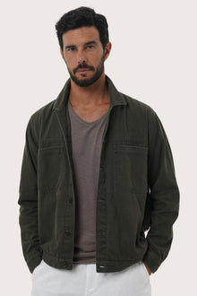 Close-up of the cotton fabric texture and refined detailing on the grey brown jacket