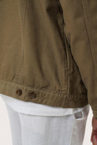 Detailed back view highlighting the relaxed silhouette and cotton craftsmanship