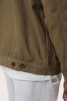 Detailed back view highlighting the relaxed silhouette and cotton craftsmanship