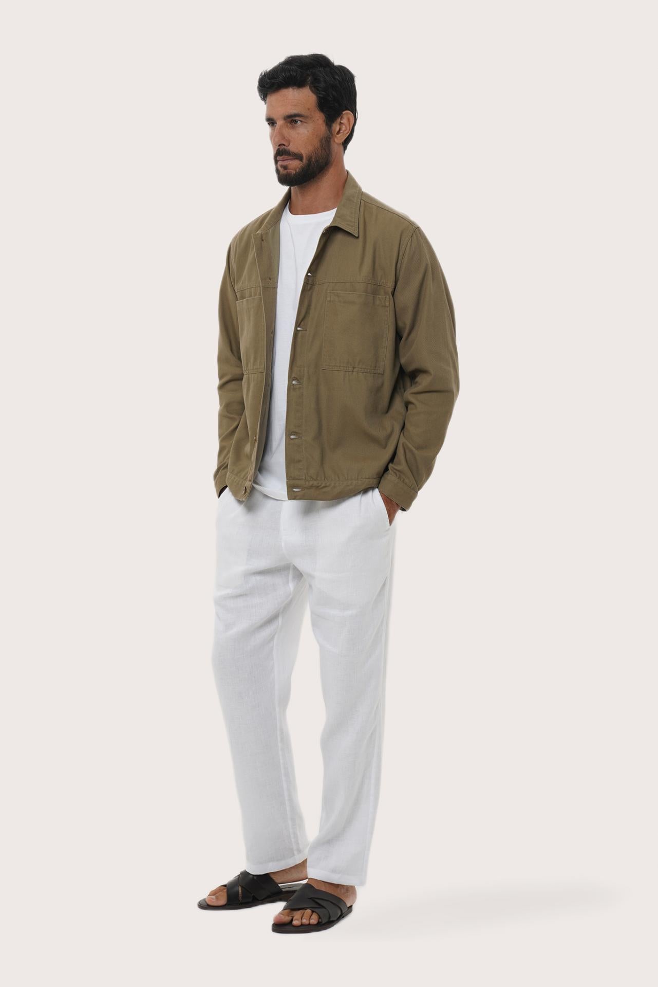 Side profile of the greyish brown cotton jacket showcasing its comfortable fit and clean lines