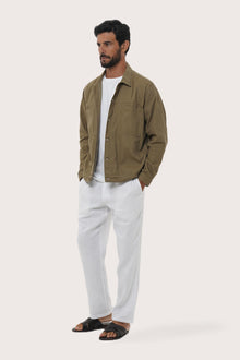 Side profile of the greyish brown cotton jacket showcasing its comfortable fit and clean lines
