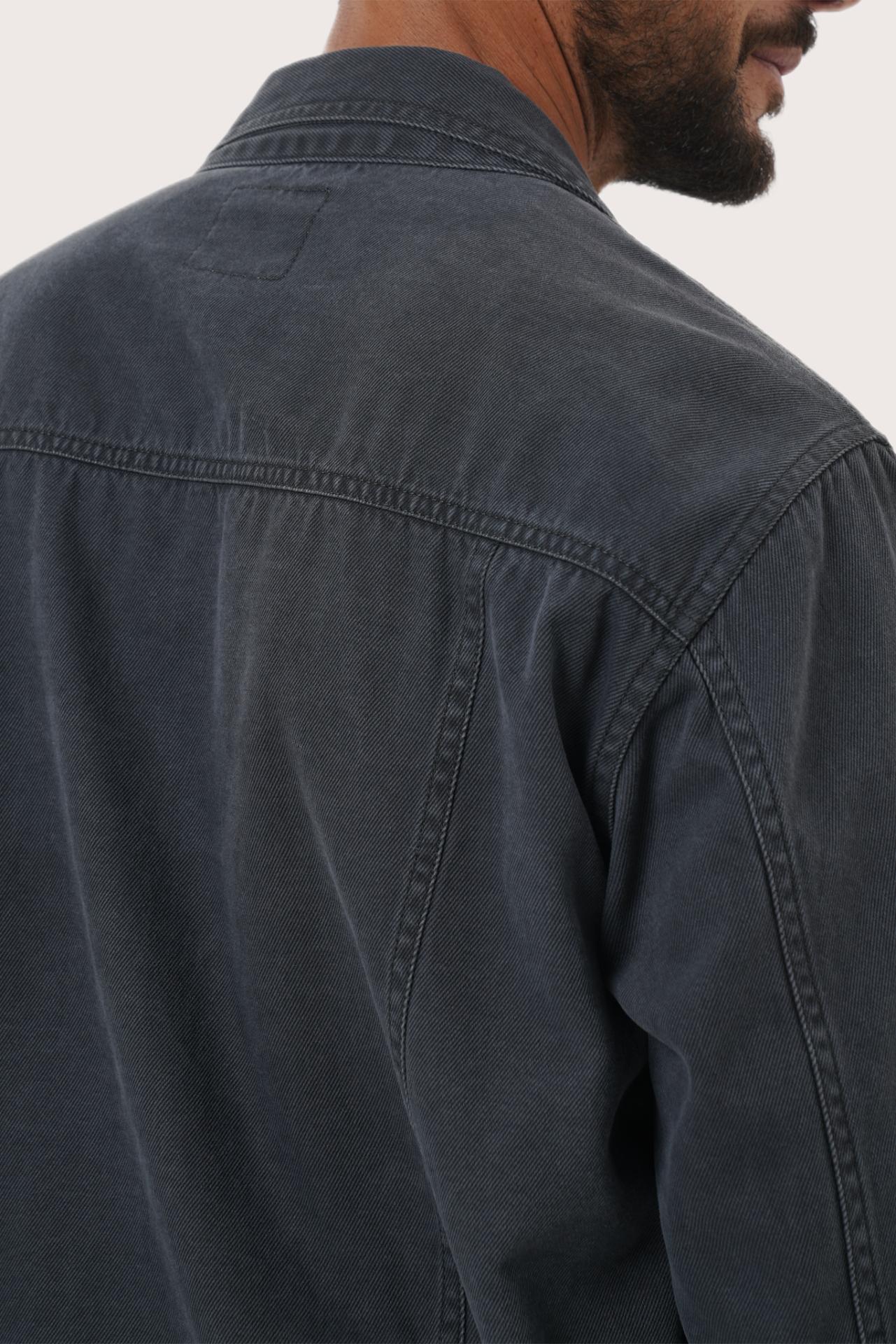 Detailed back view highlighting the relaxed silhouette and cotton craftsmanship