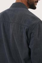 Detailed back view highlighting the relaxed silhouette and cotton craftsmanship