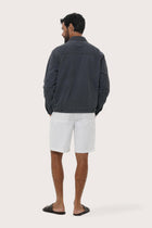 Back view of the navy cotton jacket with a relaxed and contemporary silhouette