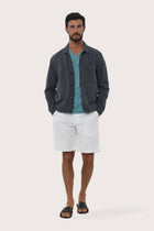 Model wearing the navy cotton Philo jacket by By The Sea Bali