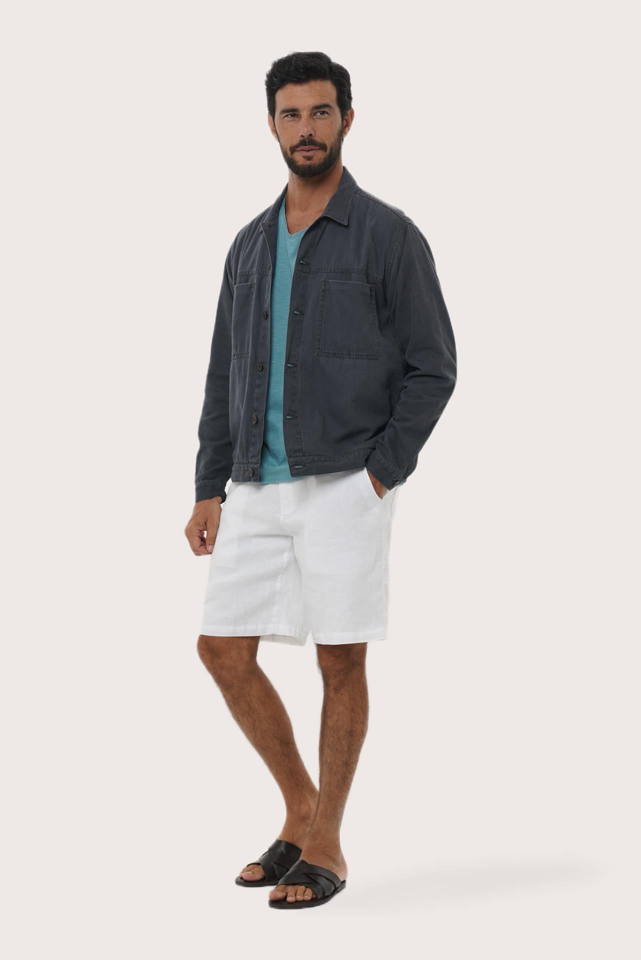 Side profile of the navy cotton jacket showcasing its comfortable fit and clean lines
