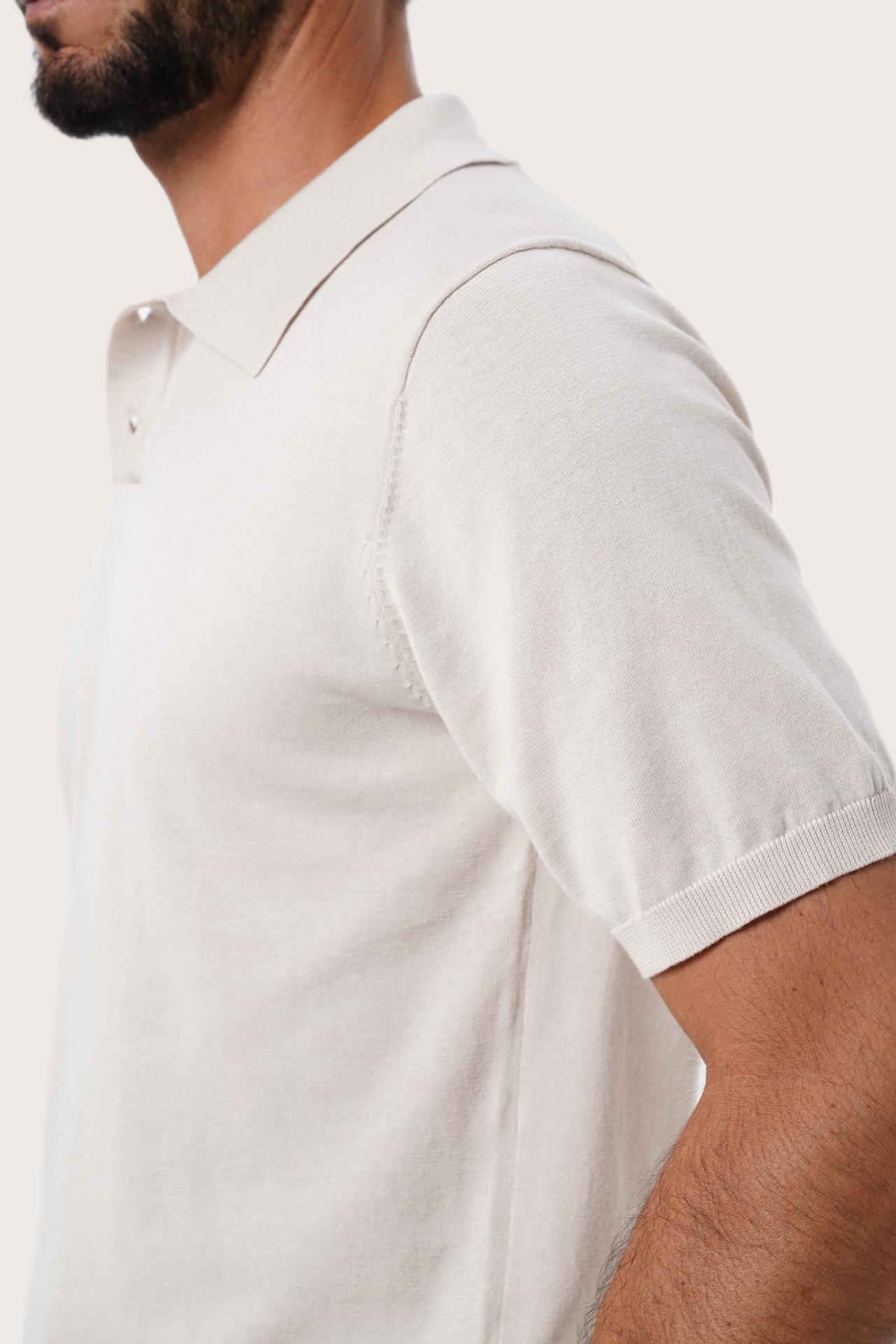 Back detail of the By The Sea Bali Rado cream cotton-knit polo shirt highlighting its premium stitching