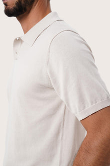 Back detail of the By The Sea Bali Rado cream cotton-knit polo shirt highlighting its premium stitching