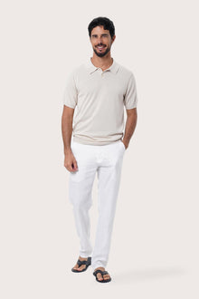 Front view of the By The Sea Bali Rado cream cotton-knit polo shirt with ribbed collar and tonal buttons