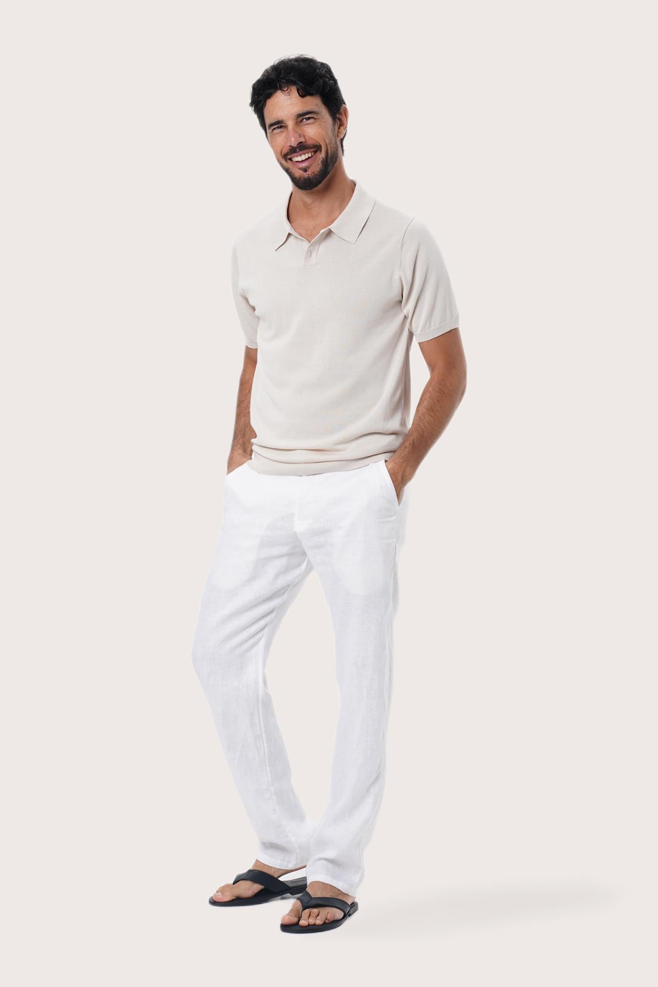Side profile of the By The Sea Bali Rado cream cotton-knit polo shirt showing its tailored relaxed fit