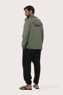 Back view of the army green hoodie jacket with a relaxed and contemporary silhouette