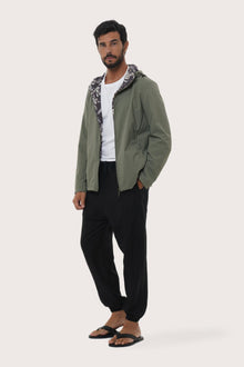 Side profile of the army green hoodie jacket showcasing its comfortable fit and clean lines