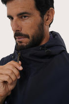Close-up of the polyester fabric texture and hoodie jacket detailing in navy
