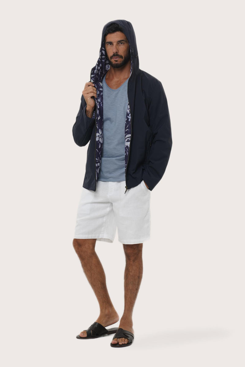 Side profile of the navy hoodie jacket showcasing its comfortable fit and clean lines