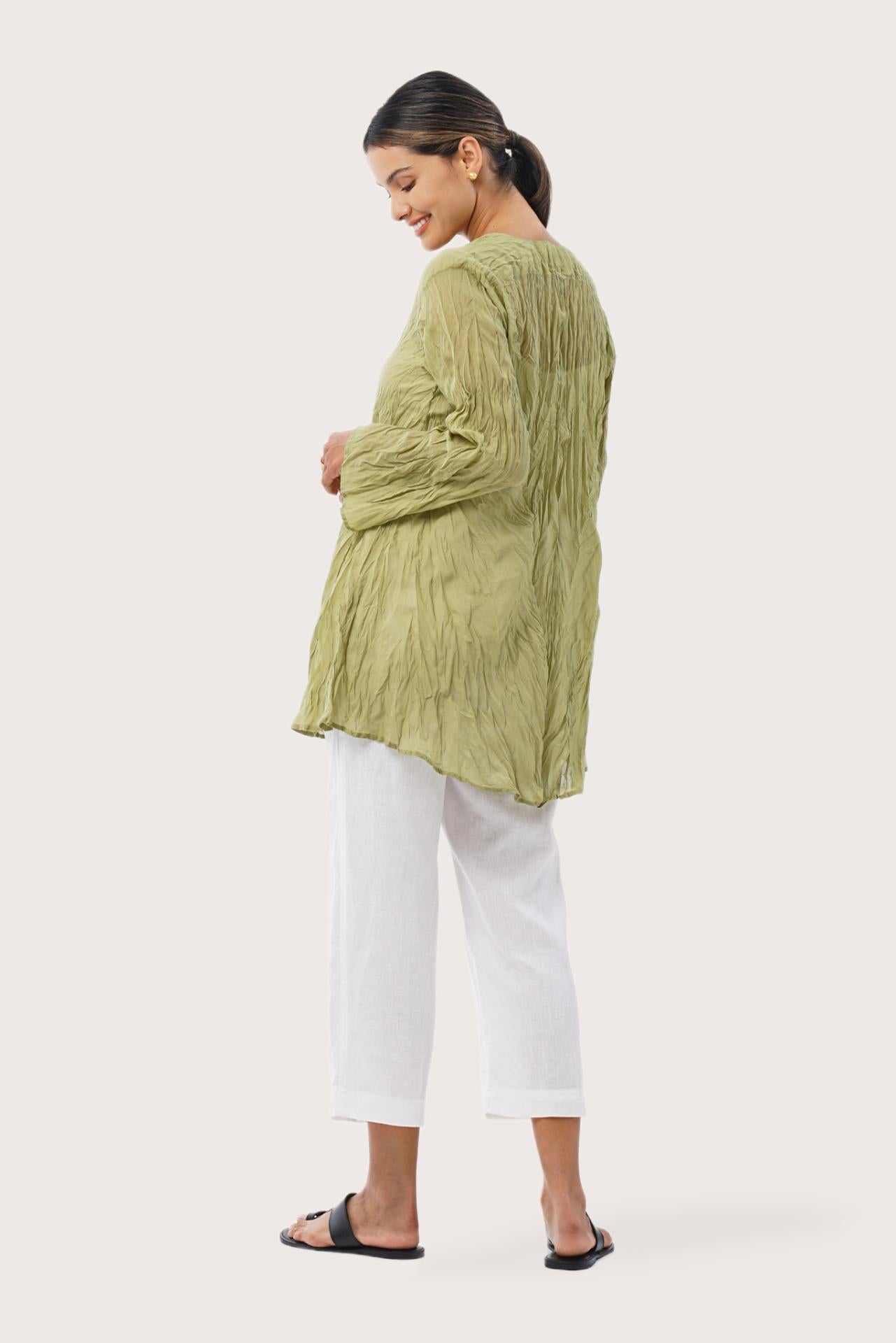 Back view of the Ravenna Cotton Outerwear Blue highlighting the garment shape and drape