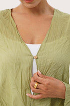 Close up detail of the Ravenna Cotton Outerwear Blue highlighting craftsmanship and design features