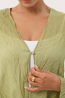 Close up detail of the Ravenna Cotton Outerwear Blue highlighting craftsmanship and design features