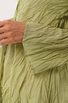 Close up detail of the Ravenna Cotton Outerwear Blue highlighting craftsmanship and design features