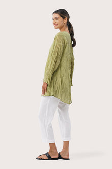 Side profile of the Ravenna Cotton Outerwear Blue showing its cut and natural movement