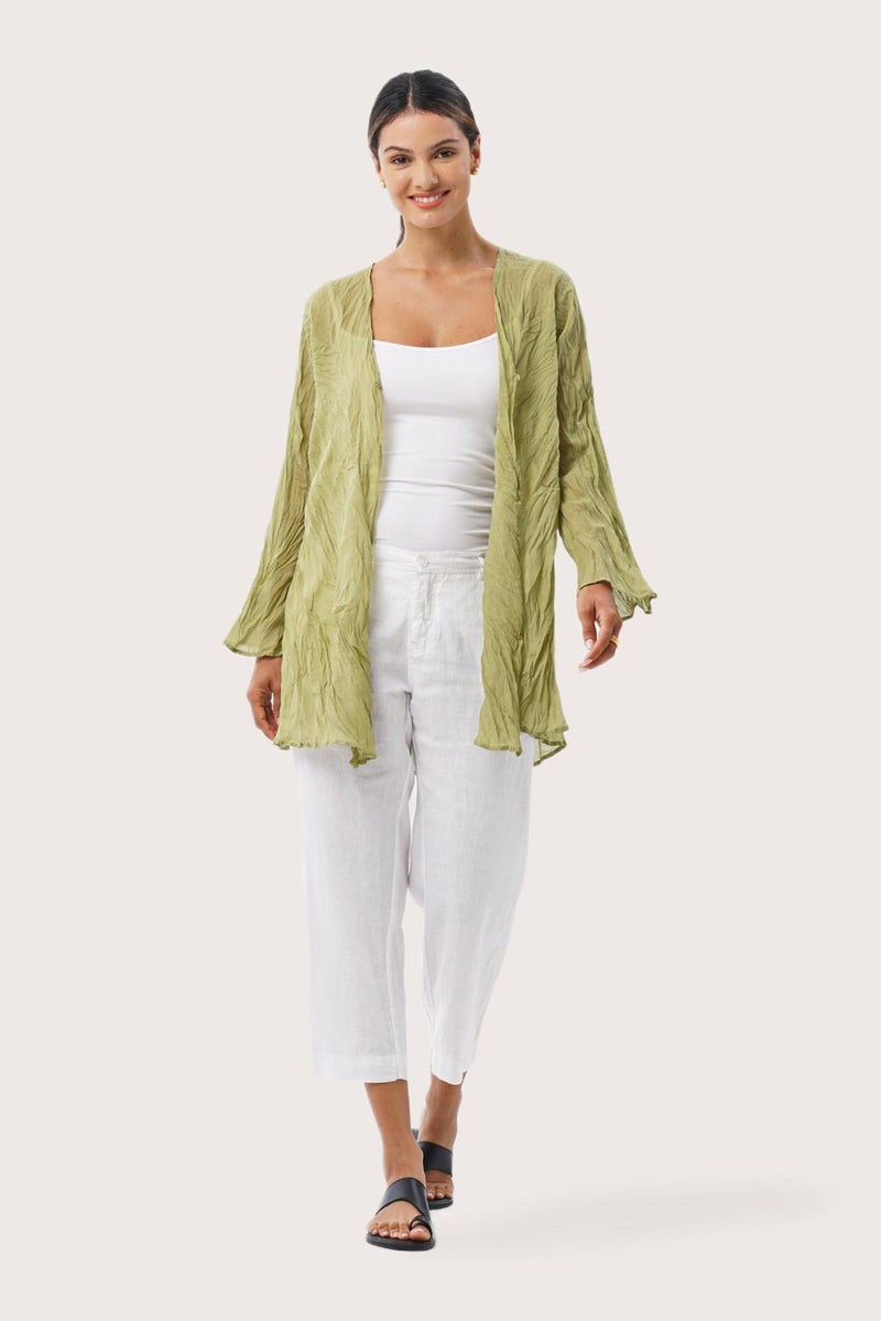 Woman wearing the Ravenna Cotton Outerwear Lime Green designed for effortless resortwear and tropical living by By The Sea Bali